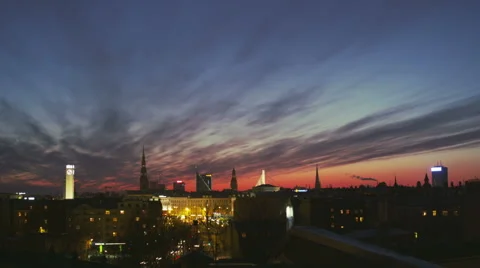 Dusk time lapse with clouds over a city skyline Stock Footage 42430523