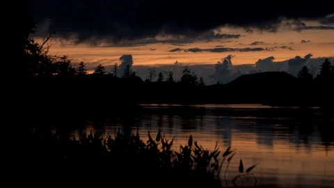 Dusk time lapse at the edge of a lake Stock-Footage 90498447