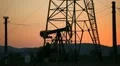 Dusk Time Lapse Shot of Oil Pump Work Gasoline Well Production Explore Field HD Footage