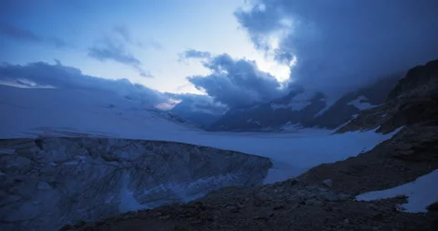 Dusk Timelapse of Clouds above Glacier and Mountains Stock Footage 169908474