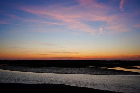 Dusk view over of the sky over a beach in the south of England 写真素材
