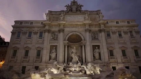 Dusk wide angle tilt down shot of trevi fountain in rome Stock Footage 69172275