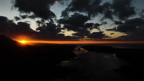 Dusky Brilliance: A Dramatic Sunrise over the Oceanic Horizon Video stock 254903036