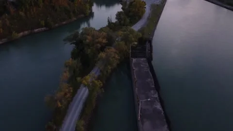 Dusky reveal of roads and trees over water Stock Footage 255095598