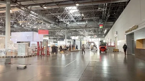 DUSSELDORF, GERMANY-2024/MARCH/05: Workers set up a stand Stock Footage 297079110