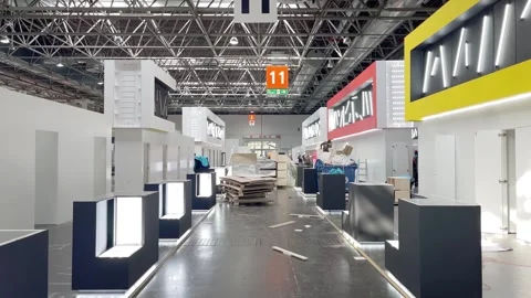 DUSSELDORF, GERMANY-2024/MARCH/06: Workers set up a stand at Prowein exhibition Stock Footage 295645320