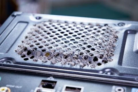 Dust accumulation on the back of a computer power supply unit reveals the need Stock Photos