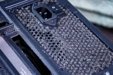 Dust accumulation on a computer fan filter reveals the need for regular Stock Photos