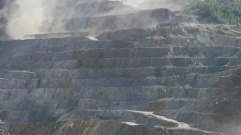Dust after dynamiting the stone in the mine quarry 動画素材 219338138
