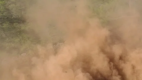 Dust and debris cloud rising from landslide. Slow-motion Stock-Footage 303005883