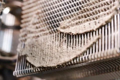 Dust buildup on a heating element in a kitchen appliance at home Stock Photos