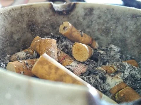 Dust of cigarettes on ashtray. Stock Photos