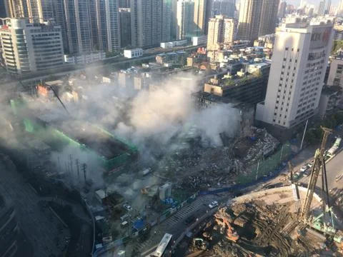 Dust cloud after building collapse during demolition Fotos de archivo