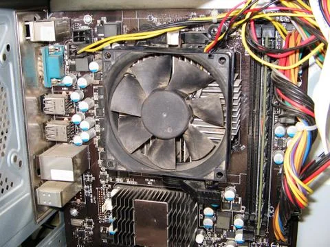 Dust on the computer pc processor cooler with mainboard and computer case fra Stock Photos