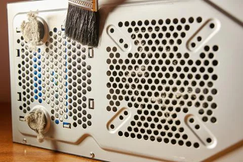 Dust contamination of the computer case grille. PC care and cleaning. Stock Photos