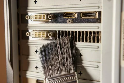Dust contamination of the computer case grille. PC care and cleaning. Stock Photos