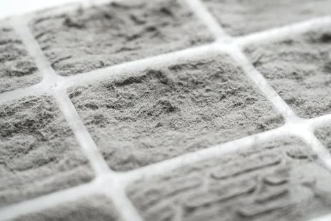 Dust covered filter surface with fiber structure and grid pattern. Photos