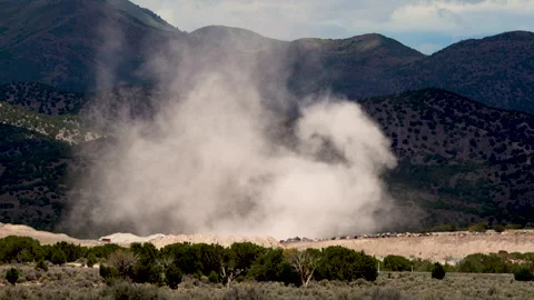 Dust devil blowing through gravel pit in the Utah desert Stock Footage 339250994
