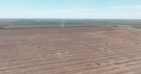 Dust Devil Crossing a Bare Field Drone Aerial View Amarillo Texas USA Stock Footage 335677507