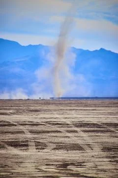 Dust Devil in Desert with Mountain Backdrop Eye-Level View Stock Photos
