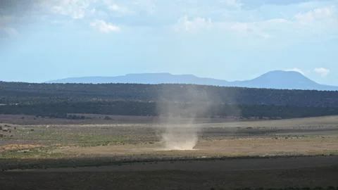 Dust devil moving through the Utah desert in slow motion Stock Footage 203839311