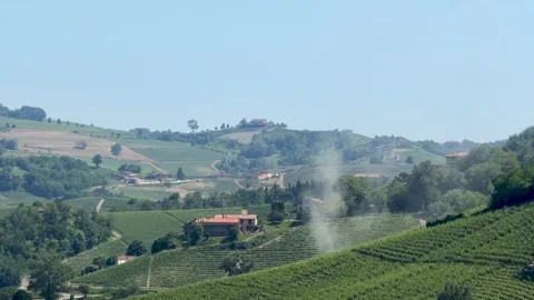 Dust Devil Swirling Over Rolling Italian Vineyard Hills in Piedmont Stock Footage 336936092