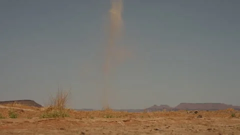 Dust devil whirlwind spinning over arid desert plain in Morocco Stock Footage 335225901