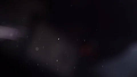 Dust flies through the air. Small particles move on a black background. Stock Footage 104702830