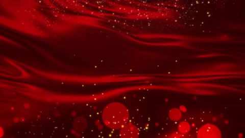 Dust Particles And Glitters Floating On The Red Wave Satin Fabric Stock Footage 139035126