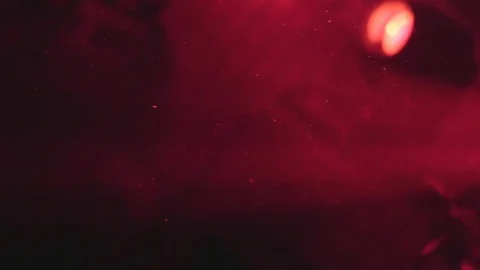 Dust particles that are moving in front of a reflector located next to Stock Footage 71171230
