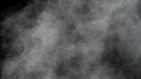 Dust particles ascending and moving in the wind on black background, 4k Stock Footage 74382391