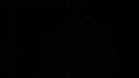 Dust particles on black background. 動画素材 257465261