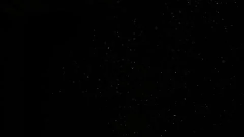 Dust particles on black background. Vídeo Stock 257465399