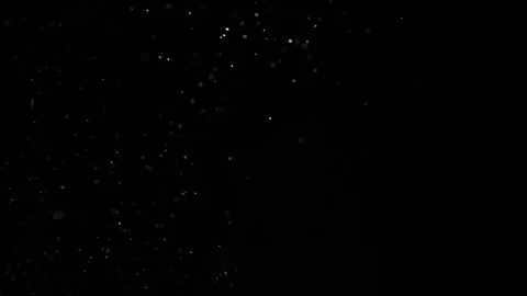 Dust particles on black background. Vídeo Stock 257465988