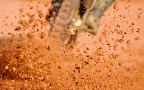 Dust Particles Explosion on Orange Abstract Background Stock Photos