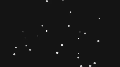Dust particles float gently in dark space with subtle light shifts during a.. Stock Footage 340906876
