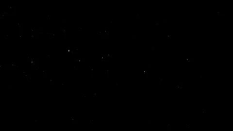 Dust Particles Floating In The Air Against A Dark Black Background. Stock Footage 302672986