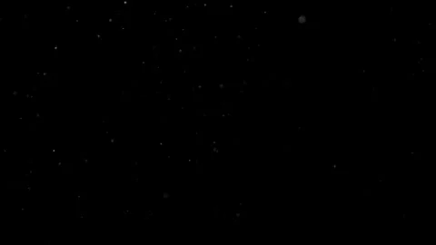 Dust Particles Floating In The Air Against A Dark Black Background. Stock Footage 302673035