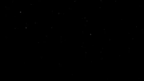 Dust Particles Floating In The Air Against A Dark Black Background. Stock Footage 302673061