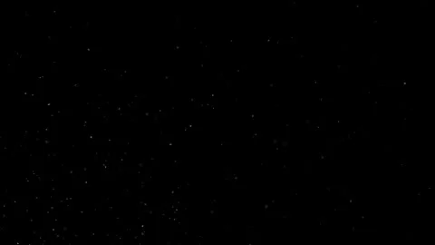 Dust Particles Floating In The Air Against A Dark Black Background. Stock Footage 302673144