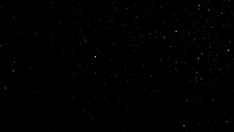 Dust Particles Floating In The Air Against A Dark Black Background. Stock Footage 302673204