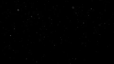 Dust Particles Floating In The Air Against A Dark Black Background. Stock Footage 302673218