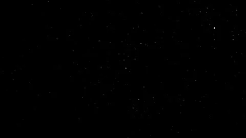 Dust Particles Floating In The Air Against A Dark Black Background. Stock Footage 302673314