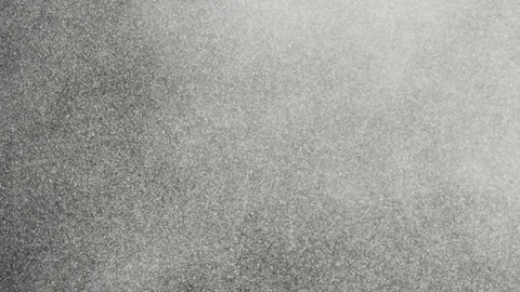 Dust particles floating slowly in space on black background Video stock 74380596