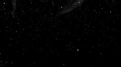 Dust Particles Flowing in Bright Light from Left to Right Video stock 53187797