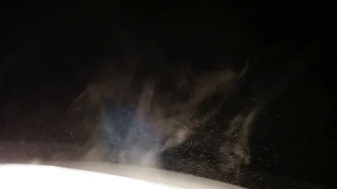 Dust Particles Flowing in Bright Light Black Background Stock Footage 99323836