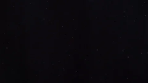 Dust particles fly on black background Stock-Footage 126169297