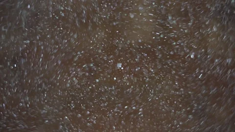 Dust particles fly in the dark room, reflected by light Stock Footage 296414322