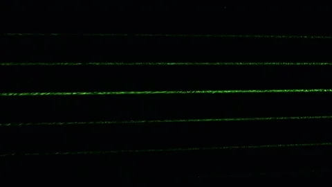 Dust particles in green laser light beam from diffraction grating Stock Footage 164954414
