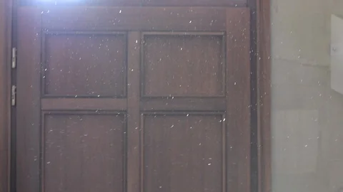 Dust particles in the house shine in the light of a window. Stock Footage 97982271